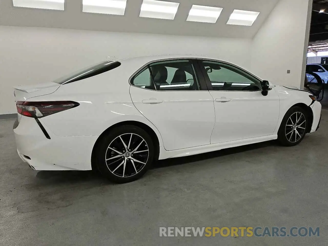 3 Photograph of a damaged car 4T1T11AK7PU825385 TOYOTA CAMRY 2023