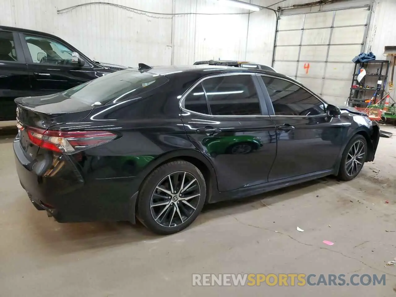 3 Photograph of a damaged car 4T1T11AKXPU779793 TOYOTA CAMRY 2023