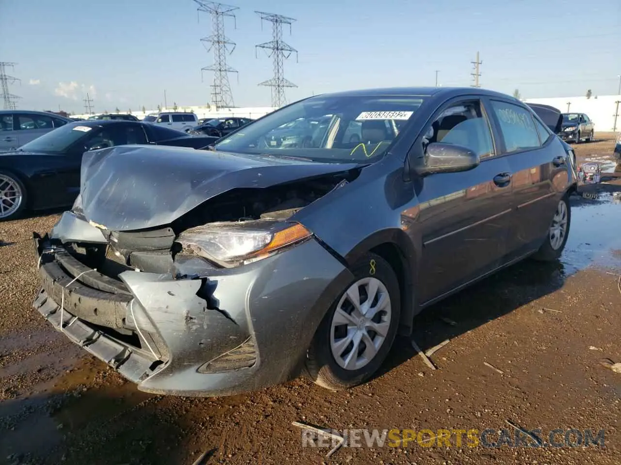 2 Фотография поврежденного автомобиля 2T1BPRHE2KC185590 TOYOTA COROLLA 2019