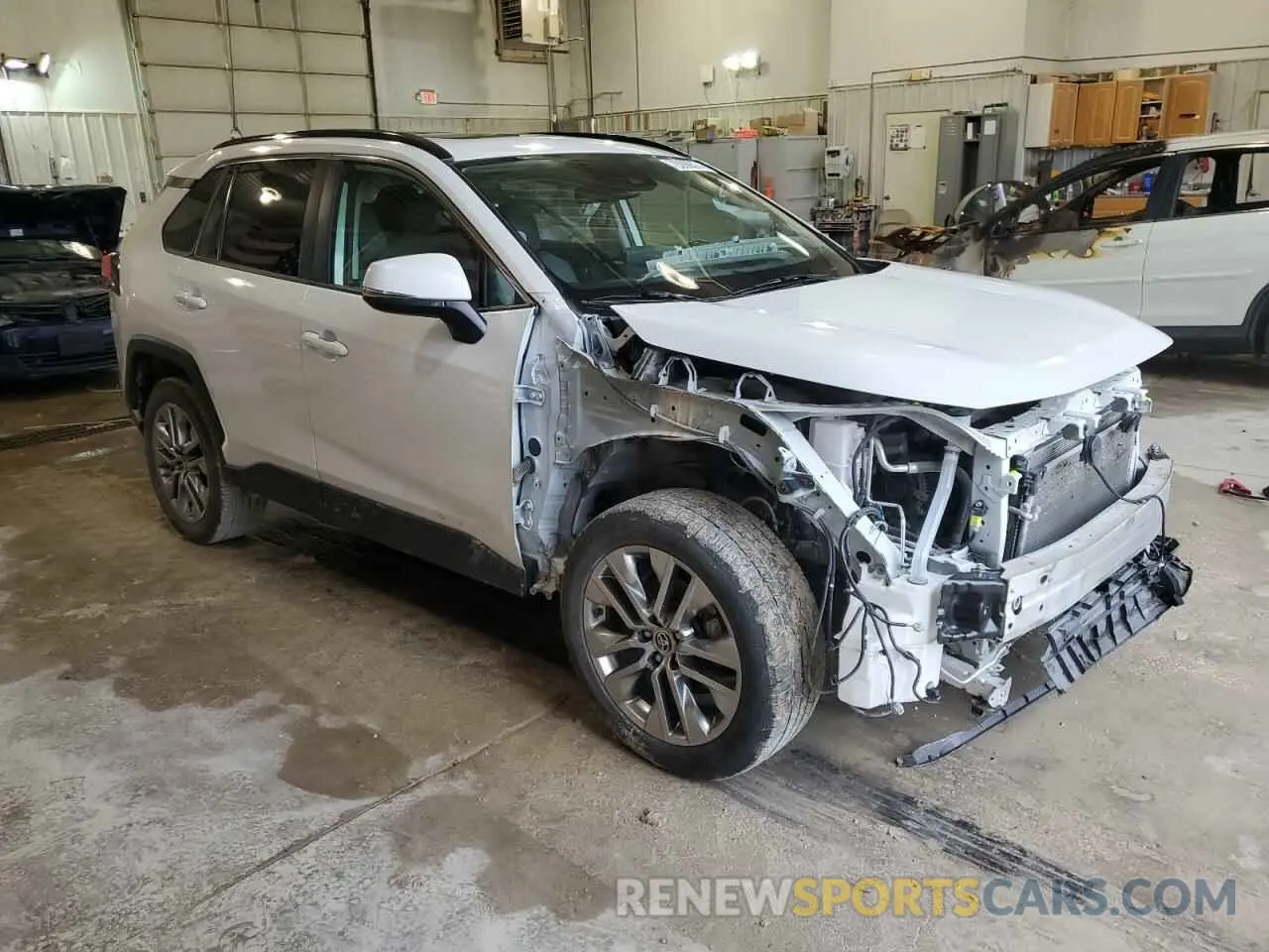 4 Photograph of a damaged car JTMA1RFV3PD093611 TOYOTA RAV4 2023