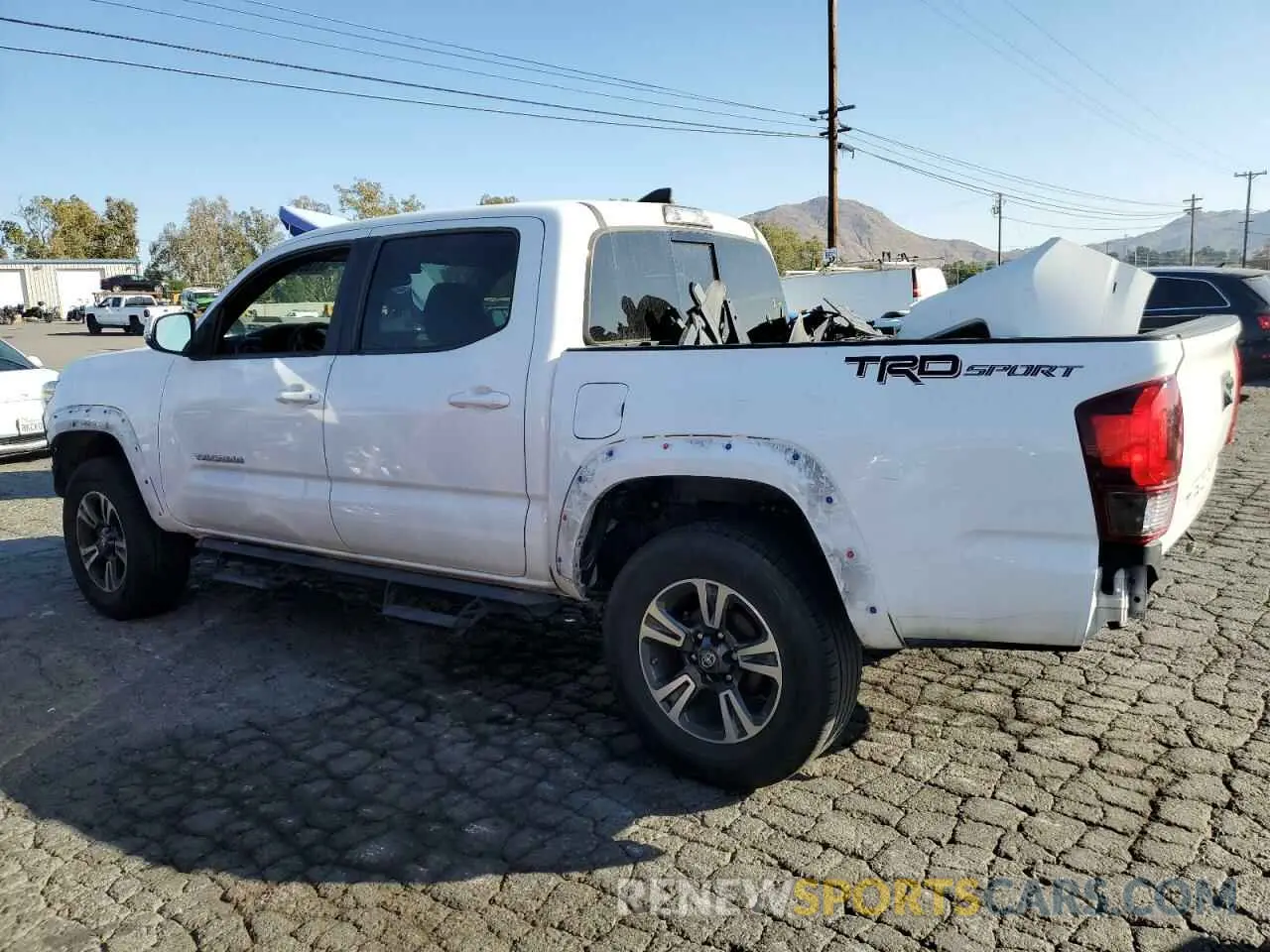 2 Photograph of a damaged car 3TMAZ5CN0KM100937 TOYOTA TACOMA 2019
