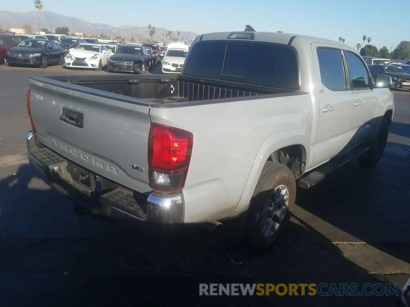 4 Photograph of a damaged car 3TMAZ5CN0KM111243 TOYOTA TACOMA 2019