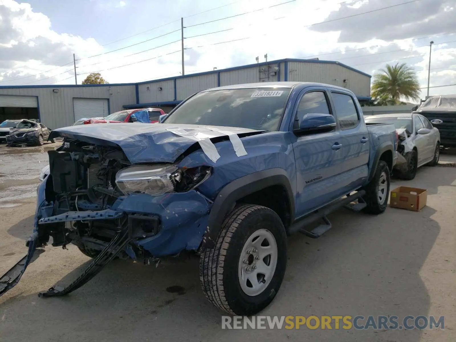 2 Photograph of a damaged car 3TMAZ5CN4KM107311 TOYOTA TACOMA 2019
