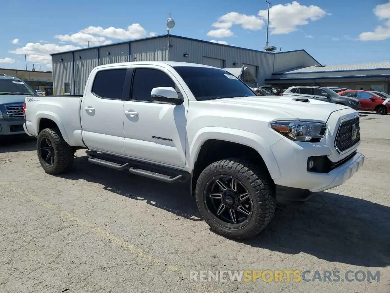 4 Photograph of a damaged car 3TMBZ5DN8KM023009 TOYOTA TACOMA 2019