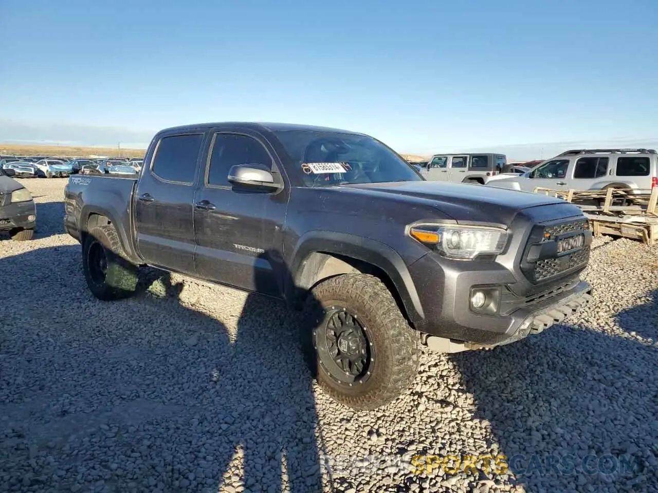 4 Photograph of a damaged car 3TMCZ5AN3KM235566 TOYOTA TACOMA 2019