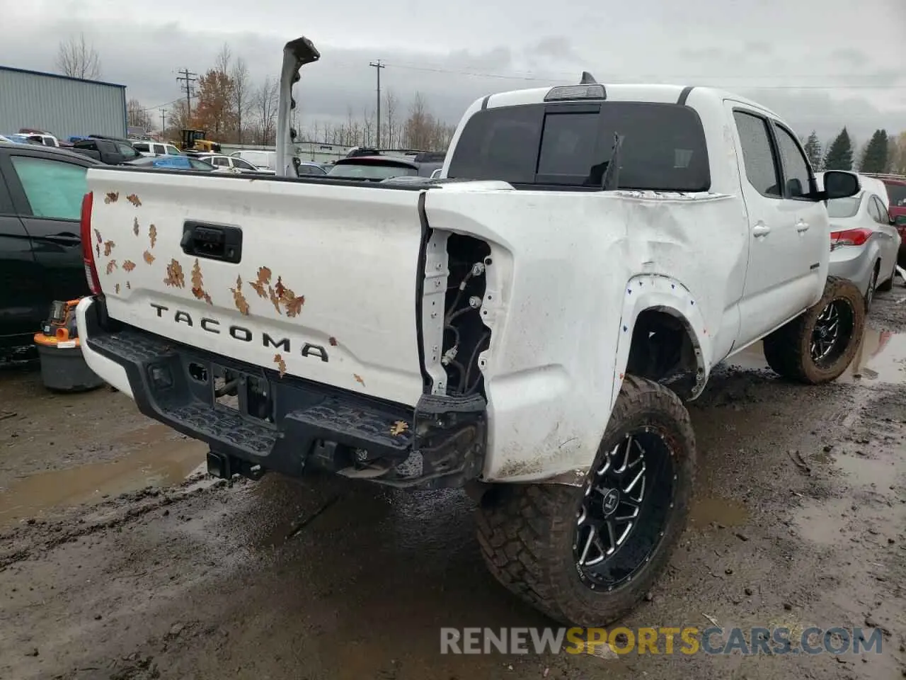 4 Photograph of a damaged car 3TMDZ5BN5KM062992 TOYOTA TACOMA 2019