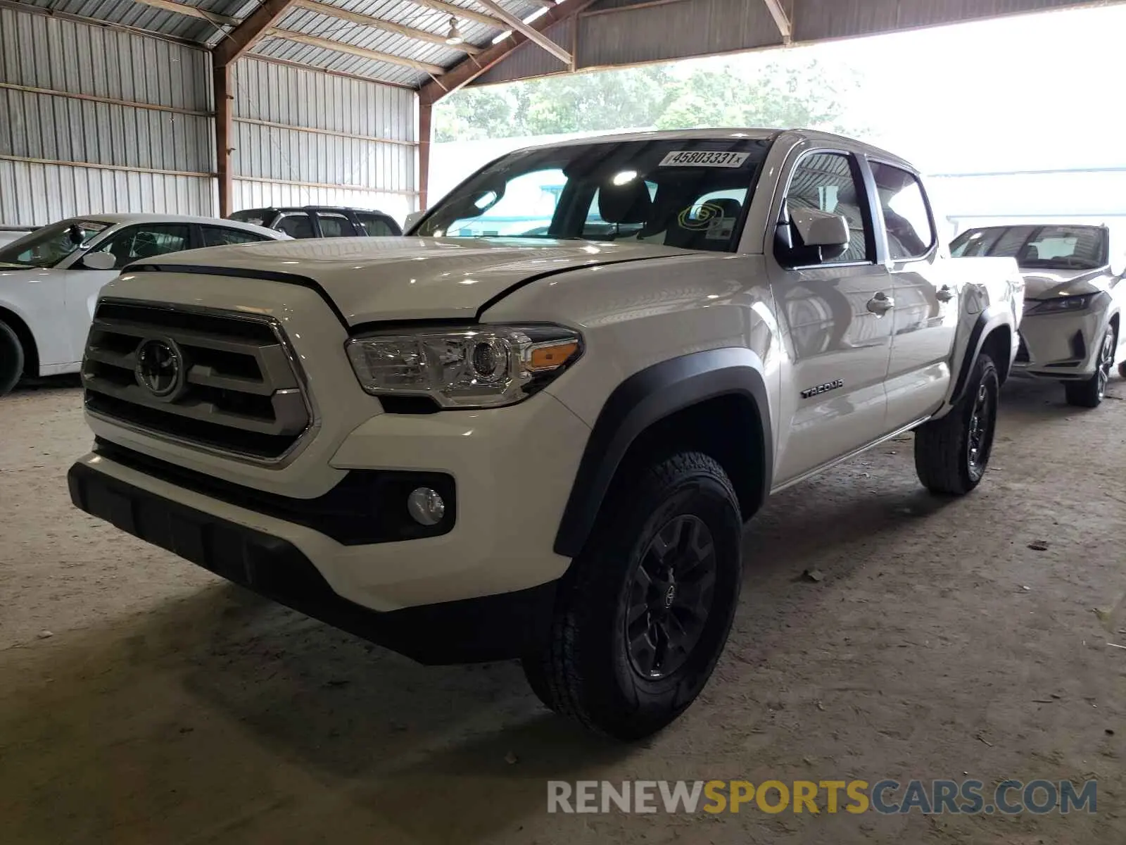 2 Photograph of a damaged car 5TFAZ5CN7MX102990 TOYOTA TACOMA 2021