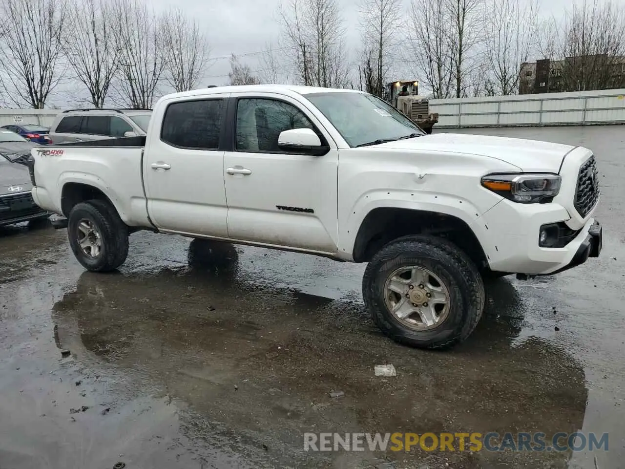 4 Photograph of a damaged car 3TMDZ5BN1PM166936 TOYOTA TACOMA 2023