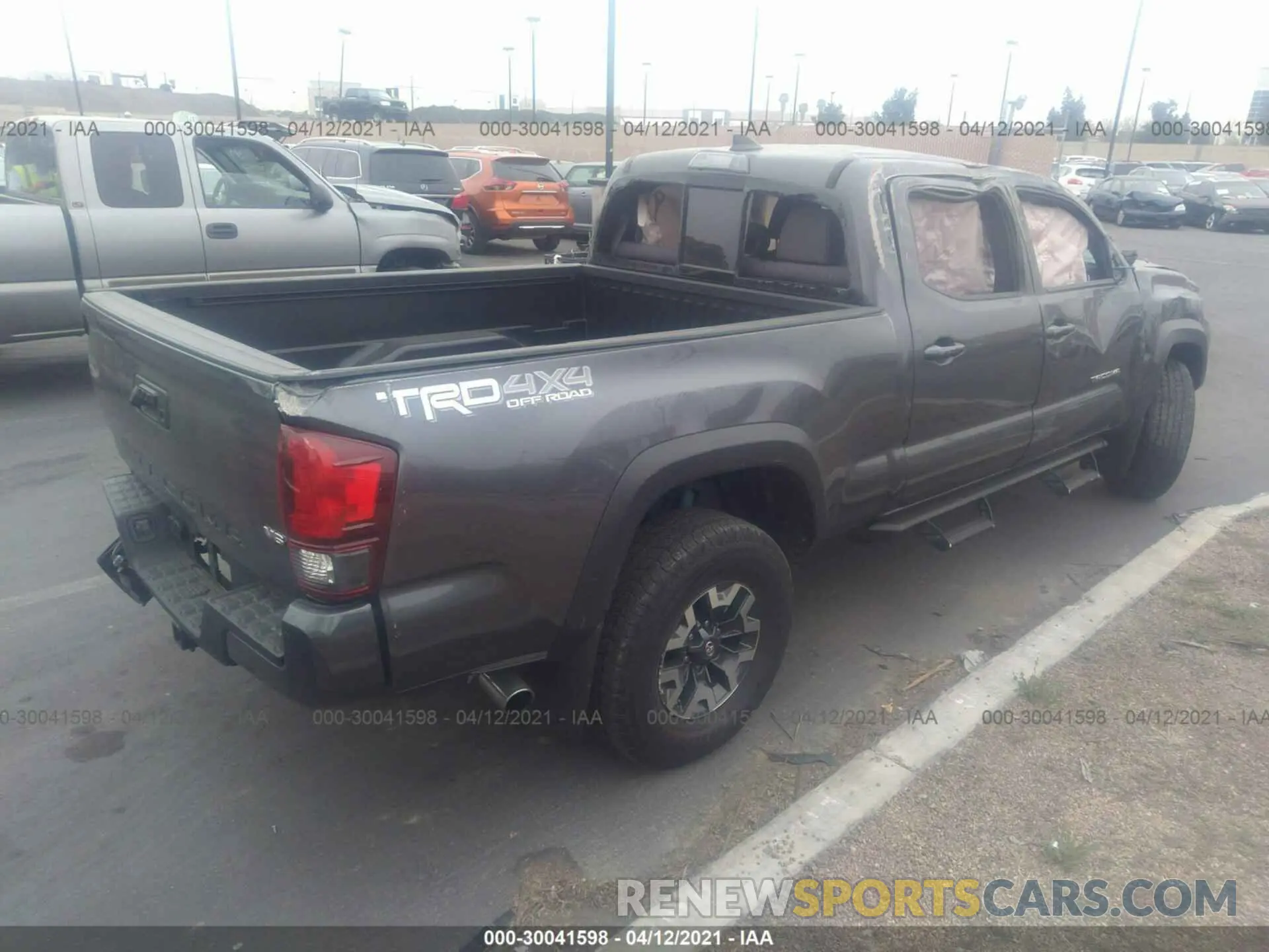 4 Photograph of a damaged car 3TMDZ5BN2KM069432 TOYOTA TACOMA 4WD 2019