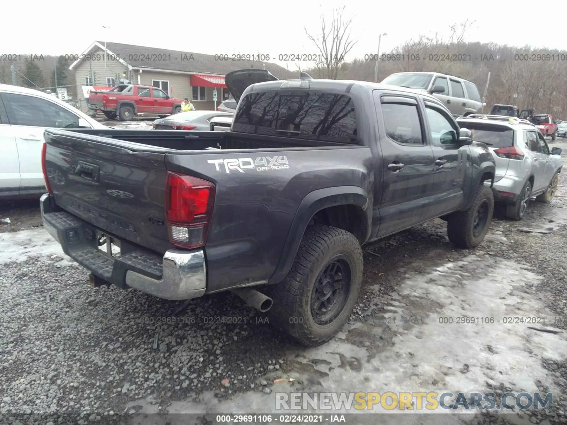 4 Photograph of a damaged car 5TFCZ5ANXKX210321 TOYOTA TACOMA 4WD 2019